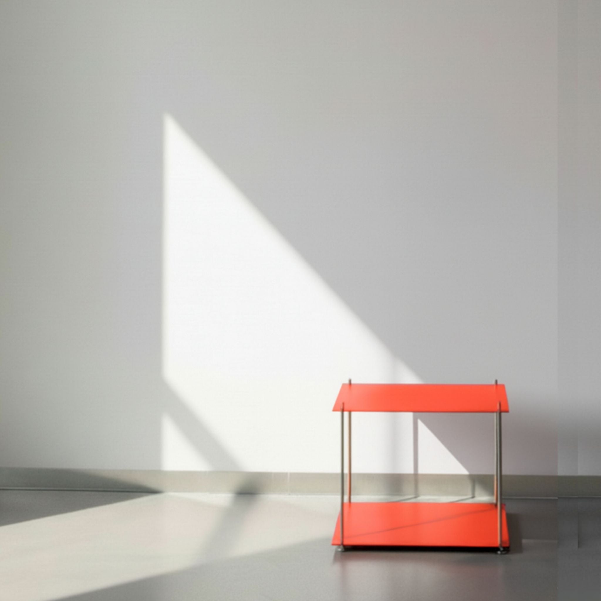 Modulum in leuchtrot mit Basismodul auf grauen Betonboden vor weißer Wand und Lichtspiel